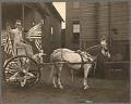 Image of John C. deHaas driving cart dressed up as 
