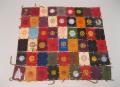 Image of Pillow sham made of leather patches featuring different college and university emblems, ca. 1910-1950