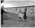 Image of Incarcerees moving into barracks at the Puyallup Assembly Center, Puyallup, March 1942