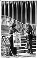 Image of Judy Balint protesting at 