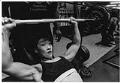 Image of Yueh-Chun Chang lifting weights, June 29, 1993