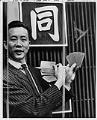 Image of Tommy Quan with Chinese New Year dinner tickets, Seattle, January 1970