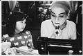 Image of Lucy Lee applying make up for Chinese opera role, Seattle, November 26, 1984