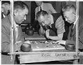 Image of Clarence Arai watching a game of Go at the Japanese Ki-in clubroom, Seattle March 6, 1957