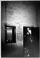 Image of Yoshiko Mita at stage door of old Nippon Kan Theater, Seattle,  February 14, 1979