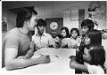 Image of Buntha Nhep counseling Taing family at the Asian Resettlement Center, Bellevue, June 14, 1982
