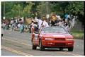 Image of Norm Rice waving from car at Mardi Gras parade, July 25, 1993