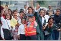 Image of Smiling spectators at Mardi Gras parade, July 25, 1993
