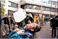 Image of Demonstrators tending to tear gas victim during WTO protest, Seattle, November 30, 1999