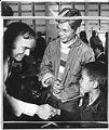 Image of Governor Dan Evans greeting Tony Le and son at Camp Murray, Washington, May 20, 1975