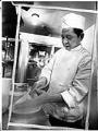 Image of Lan Van Nguyen working in kitchen at City Loan Pavilion, Seattle, February 19, 1976