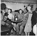 Image of Group around a table at the Basin Street nightclub, circa 1945