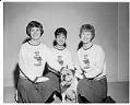 Image of Three Garfield High School cheerleaders and their bulldog mascot, November 20, 1962