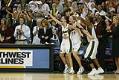 Image of Seattle Storm players cheering at WNBA championship game, Seattle, October 12, 2004