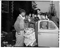 Image of Garfield students weighing donated waste paper, March 21, 1947