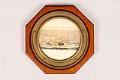Image of Porthole salvaged from the Ryo Yei Maru and featuring a photograph of the vessel, 1921