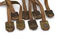 Image of Set of brass luggage claim check tags from Seattle Steamship Company, ca. 1900-1920