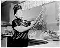 Image of Ruby Chow in the kitchen, probably in Seattle, 1960