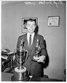 Image of Guyle Fielder with MVP trophies, Seattle, April 4, 1960