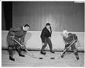 Image of Guyle Fielder and Clarence McGlothlin with hockey sticks, Seattle, January 1965