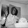 Image of James Washington Jr. carving a sculpture, Seattle, August 1965