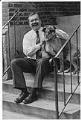 Image of Charlie Brydon and his dog sitting on steps outside his office, Seattle, June 23, 1993
