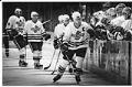 Image of Seattle Thunderbirds line up of high fives across the bench, Seattle, March 6, 1994