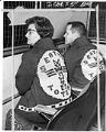 Image of Ida and Leonard Capp in Seattle Totems sweaters at game, Seattle, December 1965