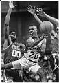 Image of Gary Payton passing basketball in game against Celtics, Seattle, December 29, 1992