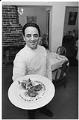 Image of Chef Thierry Rautureau holding a dish of prepared food, Seattle, January 13, 1994