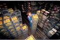Image of Mark Ostrander with stacked crates of milk at Darigold plant, Seattle, September 1993