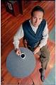 Image of Howard Schultz sitting at table with cup of coffee, Seattle, October 7, 1993