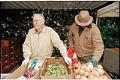 Image of Volunteer Henry Seaman distributing food at Northwest Harvest food bank, Seattle, December 1996