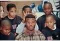 Image of Ken Griffey, Jr. with children at Rainier Vista Boys & Girls Club, Seattle,  December 16, 1996