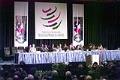 Image of Speakers on dais in front of WTO banners, Seattle, November 30, 1999