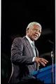 Image of Nelson Mandela speaking at welcoming ceremony at Boeing Field, Seattle, December 8, 1999