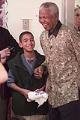 Image of Nelson Mandela with student Denis Leclech, Seattle, December 8, 1999