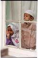 Image of Two children in the window of the Masjid Al-Salaam, SeaTac, August 3, 2001