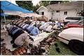 Image of Men bowing during worship outside the Masjid Al-Salaam, SeaTac, August 3, 2001