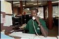 Image of William Deng working at the International Rescue Committee office, Seattle, August 2001