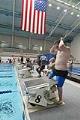 Image of Justin Fleming climbing the starting block at swim practice, Federal Way, June 12, 2002