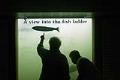 Image of Sandra and Roger Crabtree watching steelhead on Bonneville Dam fish ladder, July 26, 2002