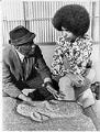 Image of James Washington Jr. explaining his work to Lee Carnett, Seattle, April 1972