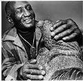 Image of James Washington Jr. with his sculpture 
