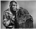 Image of James Washington Jr. with his sculpture 