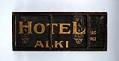 Image of Hotel Alki wooden sign, ca. 1910