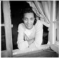 Image of Izzy Smith looking through window, circa 1948
