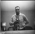 Image of Al Smith taking a self-portrait, Seattle, circa 1953