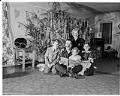 Image of Bob and Lois Hughes family sitting in front of Christmas tree, Seattle, January 1949