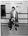 Image of Buford Ransom holding training gear at boxing gym, September 24, 1947